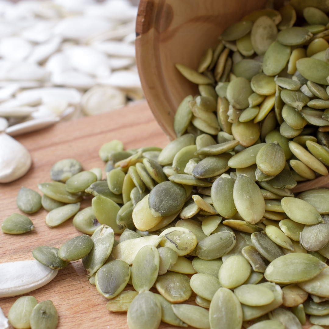 Raw green pumpkin seeds — a protein-rich, mineral-dense superfood packed with magnesium, zinc, and healthy fats. Perfect for plant-based nourishment and muscle recovery.